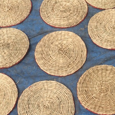 Spiral woven seagrass coasters red border