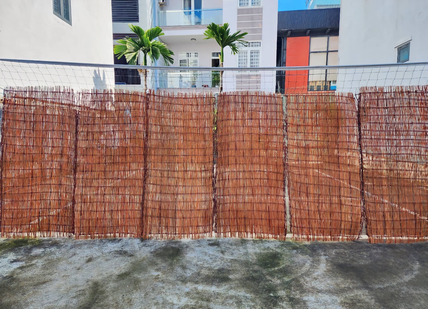 Modern handcrafted willow branch storage baskets, wreaths, and garden fence panels